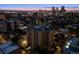 An elevated nighttime view captures the building and the city skyline in the distance at 800 N Pearl St # 1203, Denver, CO 80203