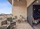 Outdoor balcony with seating, a table, tile flooring, and sliding door entry to living space at 800 N Pearl St # 1203, Denver, CO 80203