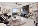 Cozy living room with a black fireplace, plush seating, and a sliding glass door to the balcony at 800 N Pearl St # 1203, Denver, CO 80203