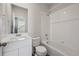 Clean bathroom features a tub, shower, and a vanity with a sink and mirror at 10065 Quari Ct, Commerce City, CO 80022