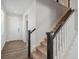 Bright entryway with hardwood floors and a staircase leading to the upper level at 10065 Quari Ct, Commerce City, CO 80022