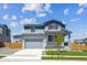 Charming two-story home with a well-manicured lawn and a welcoming front porch at 10065 Quari Ct, Commerce City, CO 80022