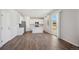 Open floorplan kitchen and living room area with hardwood floors and modern appliances at 10065 Quari Ct, Commerce City, CO 80022