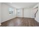 Bright living room with hardwood floors and large windows for natural light at 10065 Quari Ct, Commerce City, CO 80022