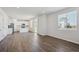 Open layout with hardwood floors, recessed lighting and seamless flow to the kitchen at 10065 Quari Ct, Commerce City, CO 80022