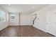 Open-concept living room with hardwood floors, recessed lighting, and large windows at 10065 Quari Ct, Commerce City, CO 80022