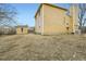A backyard view revealing a shed and the back of a home needing some TLC, with lots of potential at 1946 Ensenada St, Aurora, CO 80011