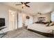 Spacious bedroom with carpeted floors, ceiling fan, and ample space at 1946 Ensenada St, Aurora, CO 80011