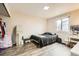 Bedroom with hardwood flooring, mirror, and closet at 1946 Ensenada St, Aurora, CO 80011