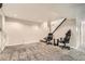 A spacious bedroom featuring plush carpet and a modern chair setup, ideal for relaxation and productivity at 1946 Ensenada St, Aurora, CO 80011