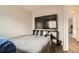 Bedroom with a large television and wood-look flooring at 1946 Ensenada St, Aurora, CO 80011