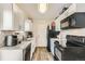 Efficient kitchen with stainless steel appliances, granite countertops, and ample cabinet space at 1946 Ensenada St, Aurora, CO 80011