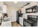 View of a kitchen offering stainless appliances, laminate countertops, and white cabinets at 1946 Ensenada St, Aurora, CO 80011