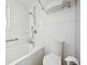 Clean bathroom featuring subway tile and a shower/tub combo at 1305 Tamarac St, Denver, CO 80220