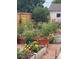 Outdoor garden with raised beds and planters, perfect for gardening at 1305 Tamarac St, Denver, CO 80220