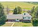 Aerial view of house and expansive backyard with mature trees and adjacent green space at 15065 Huron St, Broomfield, CO 80023