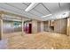 Open basement space with wood paneling, storage closets, and stairs to the upper level at 15065 Huron St, Broomfield, CO 80023
