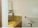Traditional bathroom with a yellow sink and decorative towel creates a cozy, vintage feel at 15065 Huron St, Broomfield, CO 80023