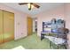 Cozy bedroom with pink walls, green carpet, and vintage-style furniture, perfect for a quiet retreat at 15065 Huron St, Broomfield, CO 80023
