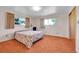 Bright bedroom featuring large windows and plush carpet. Great natural light at 15065 Huron St, Broomfield, CO 80023