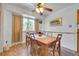 Bright dining area with a wooden table, chairs, and ample natural light from a window at 15065 Huron St, Broomfield, CO 80023