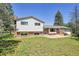 Well-maintained home featuring brick and siding, set on a green lot with mature trees at 15065 Huron St, Broomfield, CO 80023