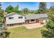 Charming two-story home with brick and siding exterior and mature trees at 15065 Huron St, Broomfield, CO 80023