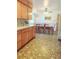Eat-in kitchen with retro-style appliances and light wood cabinetry at 15065 Huron St, Broomfield, CO 80023