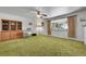 Bright living room with green carpet, large window, and classic furniture at 15065 Huron St, Broomfield, CO 80023