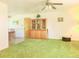 The sun-filled living room features a vintage cabinet for displaying treasures at 15065 Huron St, Broomfield, CO 80023