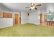 Open living room layout showing access to kitchen, carpet flooring and natural light at 15065 Huron St, Broomfield, CO 80023