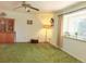 Cozy living room features bright window and traditional built-in cabinet at 15065 Huron St, Broomfield, CO 80023