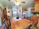 Open living space with dining area and kitchen featuring vintage decor at 15065 Huron St, Broomfield, CO 80023