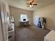 Large bedroom with a ceiling fan, desk and closet at 504 Elizabeth Ave, Platteville, CO 80651