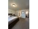 Bedroom featuring a large bed with nightstands, bathroom and closet doors at 504 Elizabeth Ave, Platteville, CO 80651