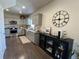 Well-lit kitchen features gray cabinets, stainless steel appliances, and stylish decor at 504 Elizabeth Ave, Platteville, CO 80651