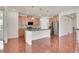Spacious kitchen featuring stainless steel appliances, a central island, and modern finishes at 16076 Columbine Pl, Thornton, CO 80602