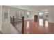 Spacious living area with hardwood floors, fireplace, and abundant natural light at 16076 Columbine Pl, Thornton, CO 80602