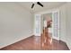 Office featuring hardwood floors and double french doors leading to kitchen at 16076 Columbine Pl, Thornton, CO 80602