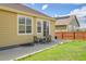 Back patio perfect for entertaining, features outdoor seating, grassy area, and private fenced yard at 16076 Columbine Pl, Thornton, CO 80602