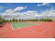 Community tennis courts for recreation and exercise, surrounded by lush landscaping at 16076 Columbine Pl, Thornton, CO 80602