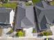 Aerial view of a home with a driveway and manicured lawn nestled in a residential neighborhood at 21893 E Tufts Cir, Aurora, CO 80015