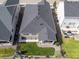 Overhead shot of a home with a dark roof, covered patio, and tidy backyard, surrounded by other houses at 21893 E Tufts Cir, Aurora, CO 80015