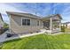 Charming home featuring a covered patio and well-maintained backyard perfect for outdoor enjoyment at 21893 E Tufts Cir, Aurora, CO 80015
