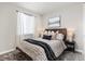 Calm bedroom with soft carpet, neutral walls, and a comfortable queen-sized bed at 21893 E Tufts Cir, Aurora, CO 80015