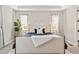 Nicely appointed bedroom featuring tray ceiling, ceiling fan, and contemporary decor at 21893 E Tufts Cir, Aurora, CO 80015
