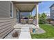 Inviting covered patio with comfortable seating, ideal for relaxing and entertaining guests at 21893 E Tufts Cir, Aurora, CO 80015