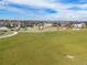 Spacious community green space with walking paths surrounded by homes at 21893 E Tufts Cir, Aurora, CO 80015