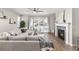 Relaxing living room featuring fireplace, mantel, and sliding doors to the backyard at 21893 E Tufts Cir, Aurora, CO 80015