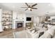 Inviting living room with fireplace and open floor plan connecting to a modern kitchen at 21893 E Tufts Cir, Aurora, CO 80015